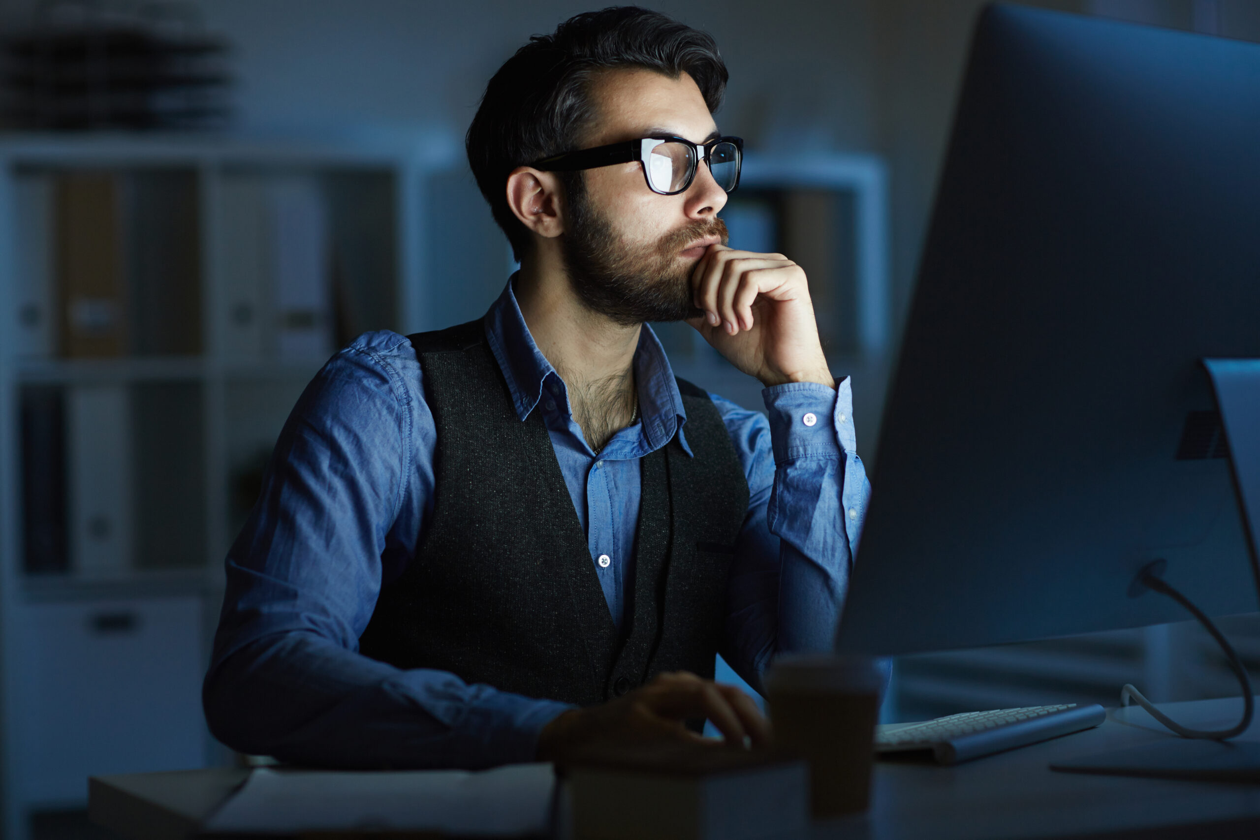 A focused DevOps engineer working late at a computer in a dark office, representing the invisible yet powerful role of DevOps in driving modern software delivery and automation. A focused DevOps engineer working late at a computer in a dark office, representing the invisible yet powerful role of DevOps in driving modern software delivery and automation.